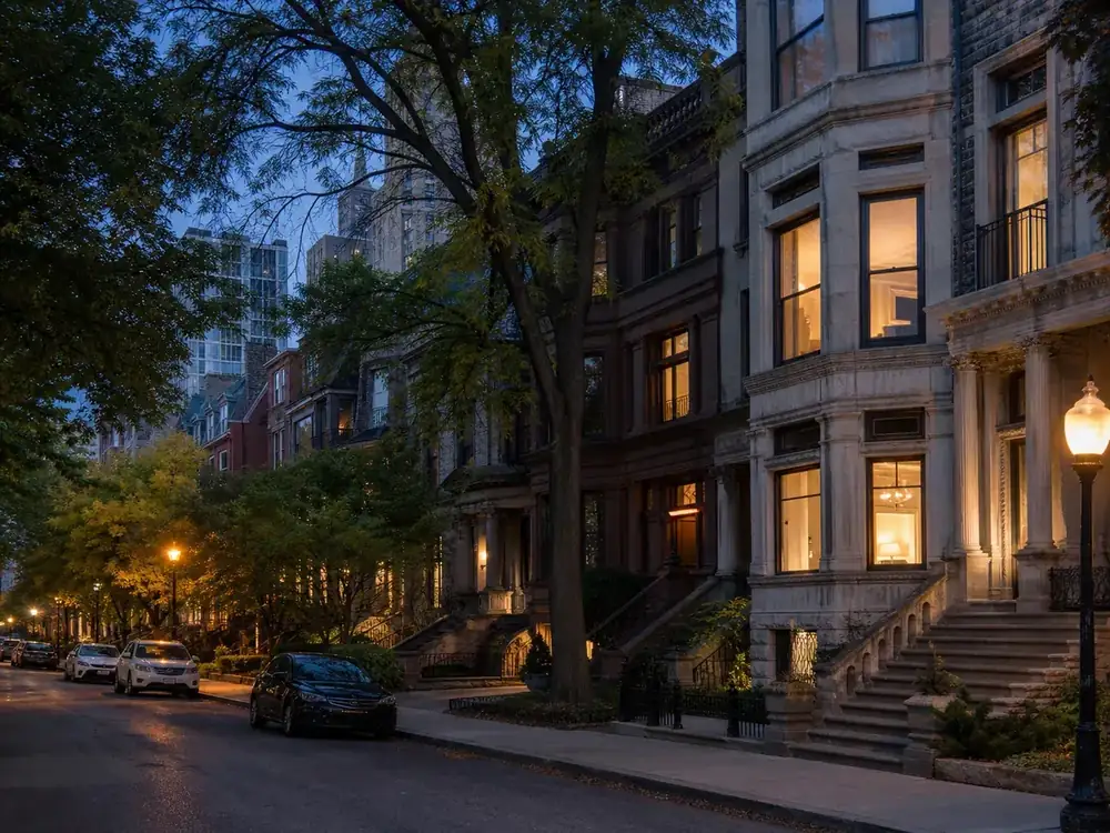 Historic homes along a tree-lined Gold Coast street at dusk