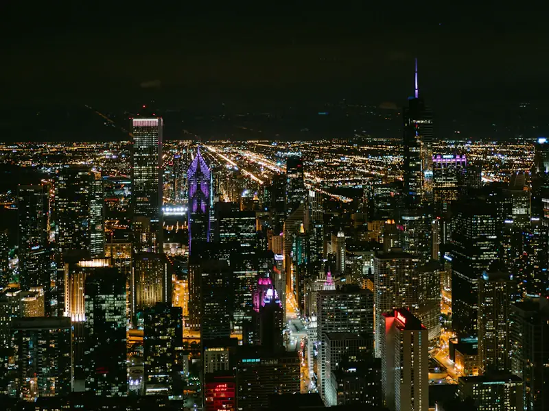 Rooftop terrace in River North with the downtown skyline lit behind it